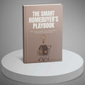 Book titled 'The Smart Homebuyer's Playbook' on a round white platform with a gray background