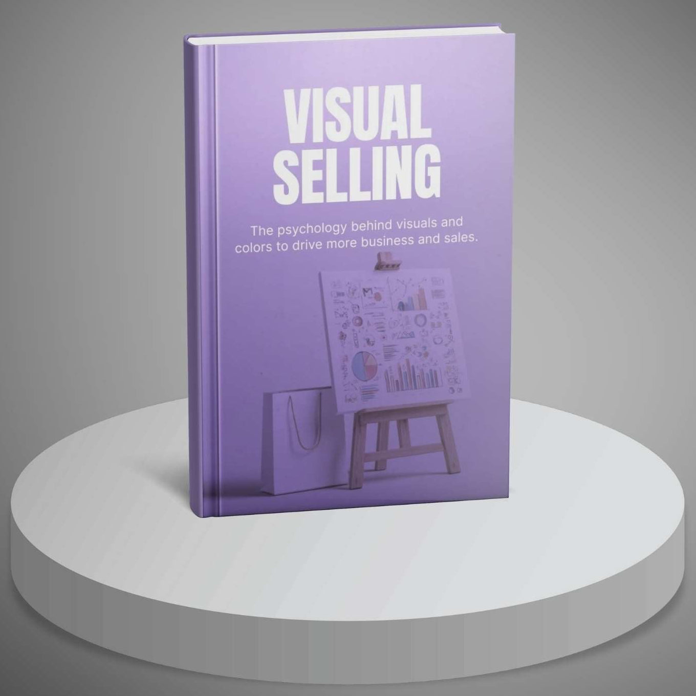 Book titled 'Visual Selling' on a round white platform with a gray background